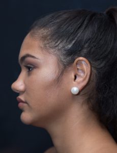 Model wearing large stud earring